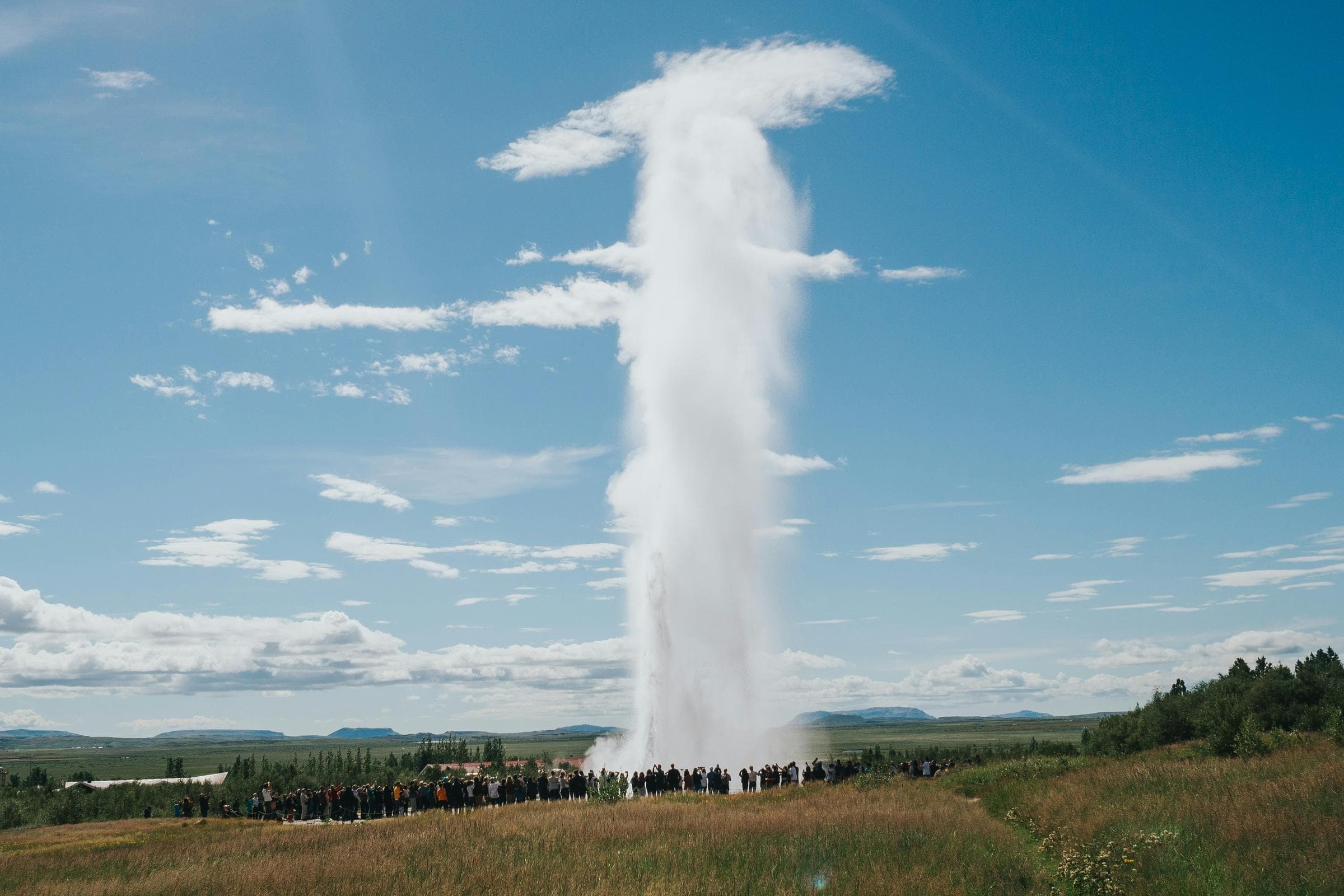 The Geysir geothermal area, home to steaming hot springs and Strokkur, the erupting geyser that sends boiling water high into the air every few minutes.