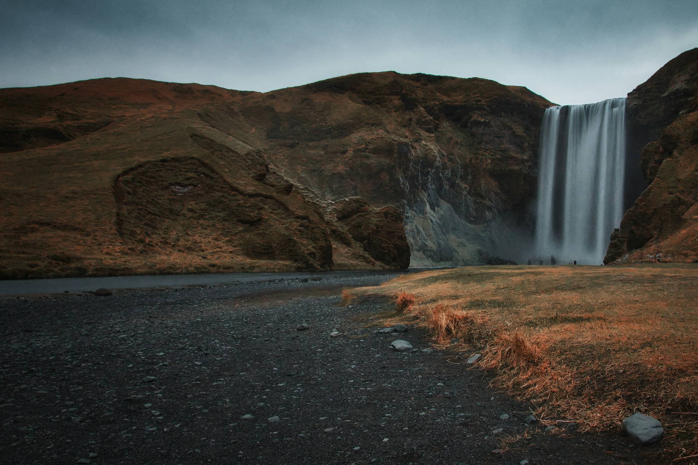 Skogafoss waterfall, a powerful cascade surrounded by dramatic South Coast scenery.